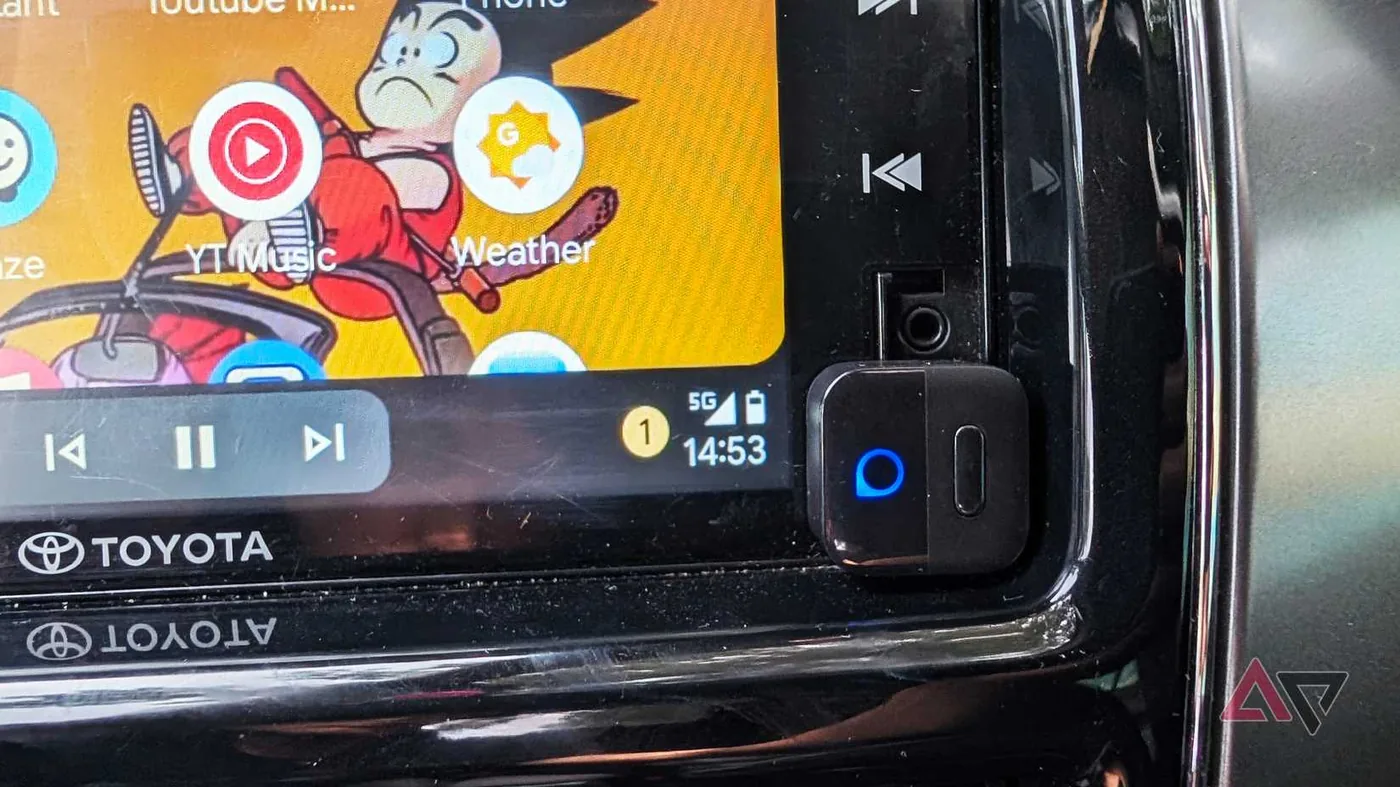 Ottocast Mini Pico wireless adapter connected to a Toyota vehicle display running navigation and media apps.
