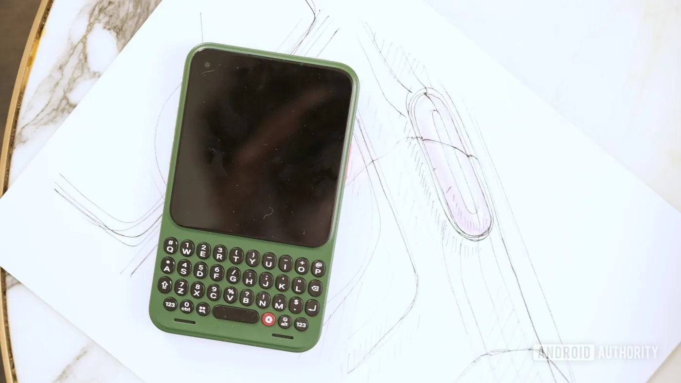 The Clicks Communicator smartphone shown in a green finish.