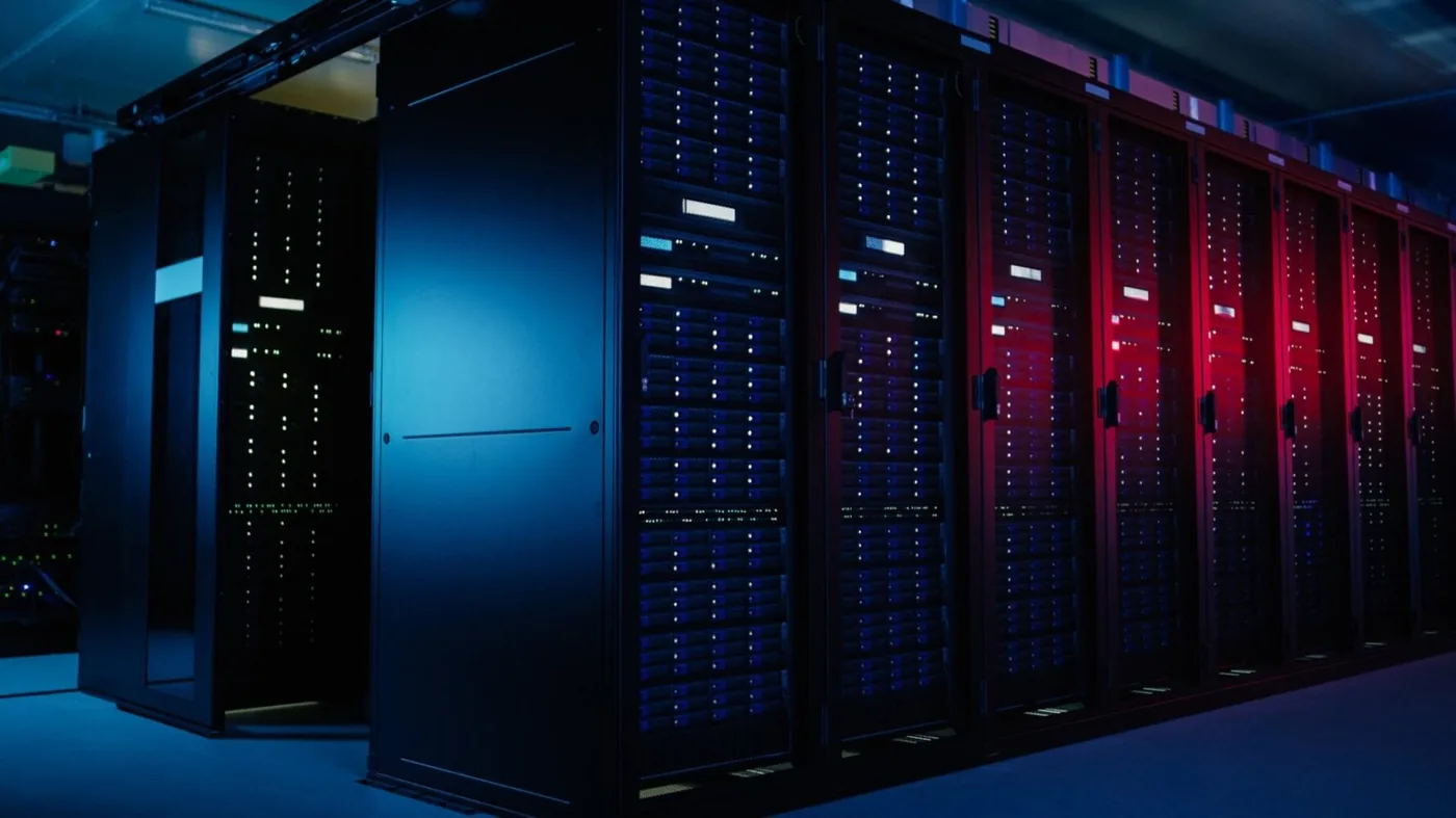 Industrial server racks inside a computing facility where community groups have organized data center opposition.