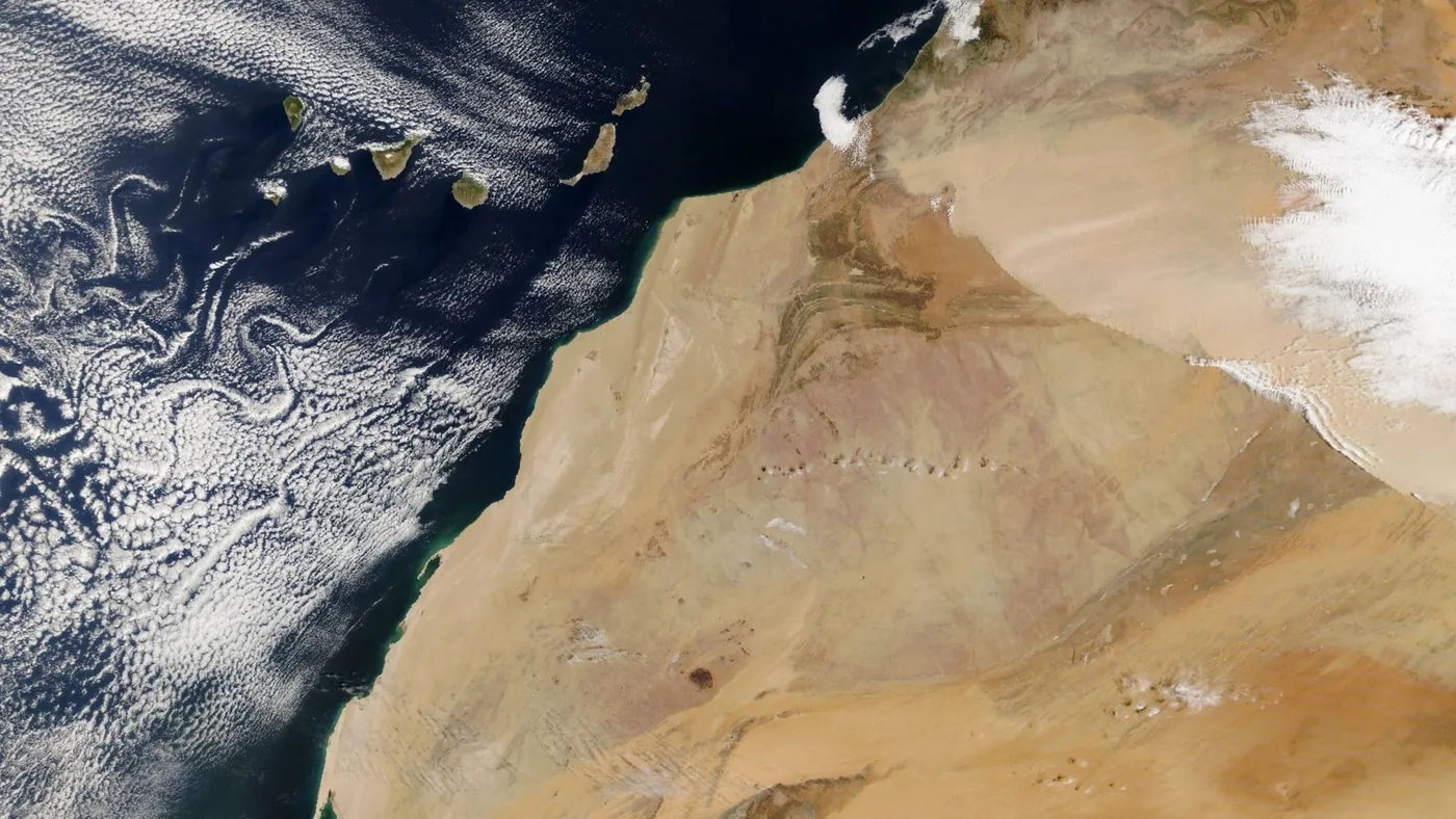 Satellite image of a dust plume over northwestern Africa and the nearby Atlantic.