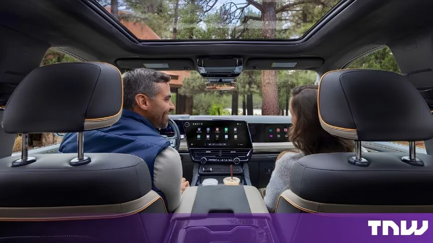 A split-screen display inside a redesigned GM pickup truck showcasing the GM CarPlay update.