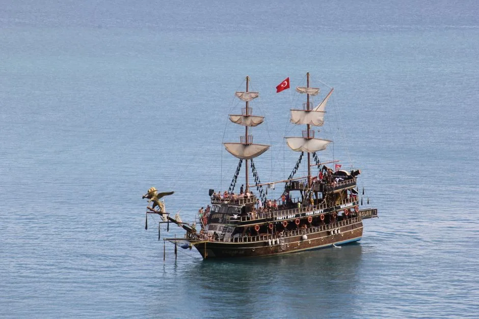 Sailing vessel navigating coastal trade routes during the golden age of piracy.