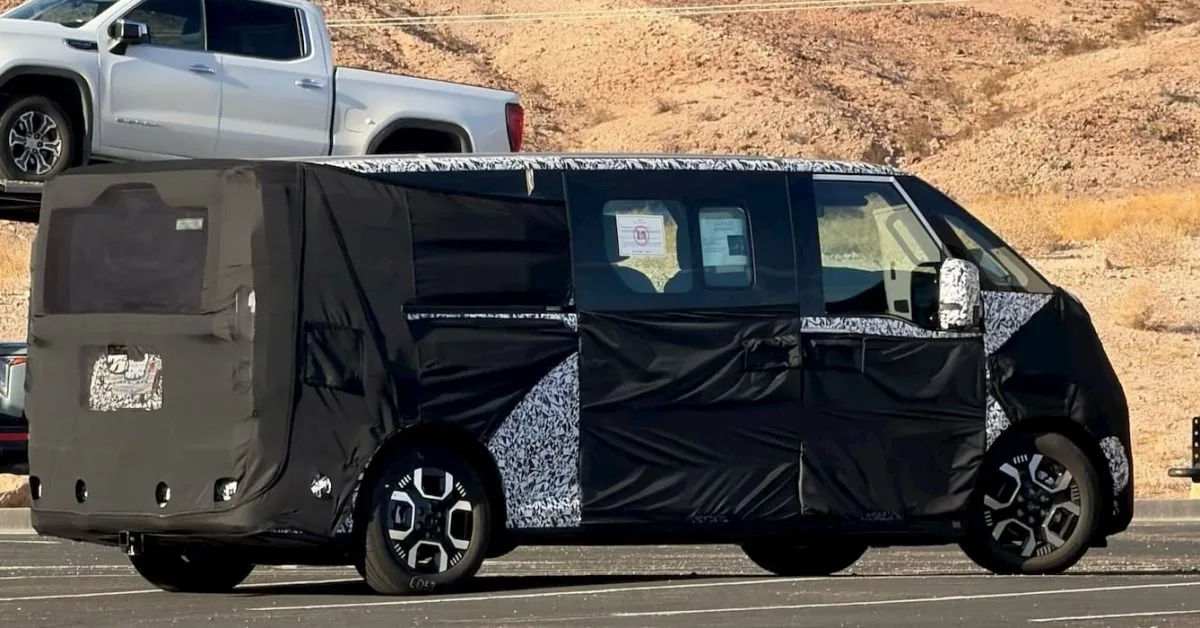 A disguised prototype of the Kia electric van spotted during testing in the United States.