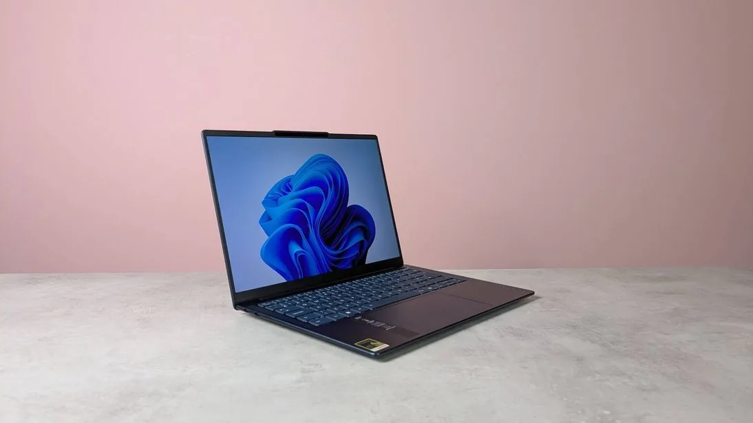 The Lenovo Yoga Slim 7x laptop showing its slim profile and keyboard deck.