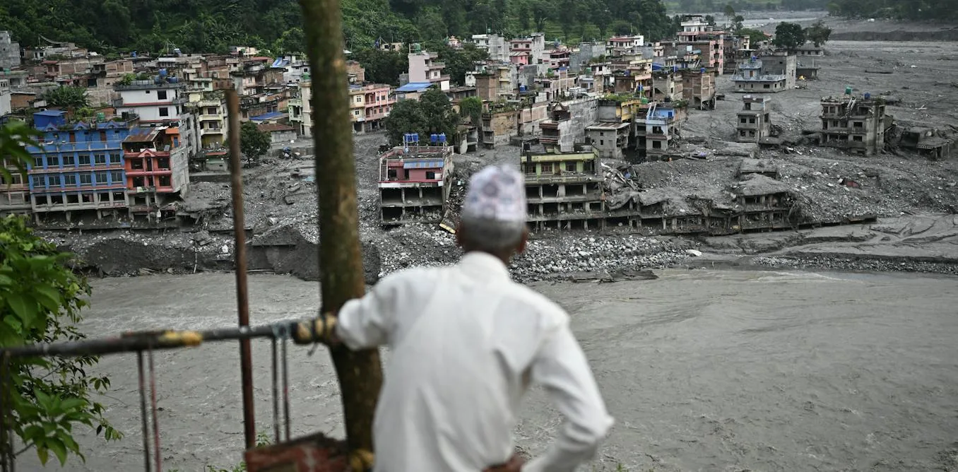 Mountain valley landscape in Nepal inundated by river torrents and debris.