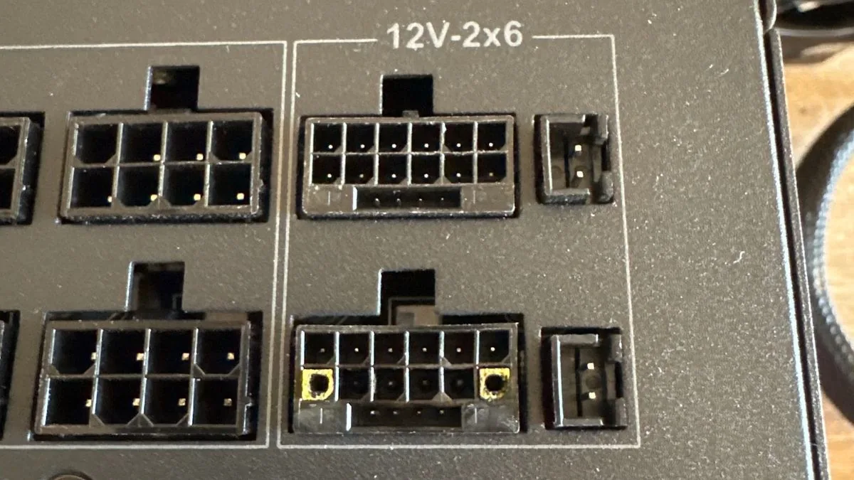 A damaged 12V-2x6 connector from a power supply connected to a melted RTX 5090.