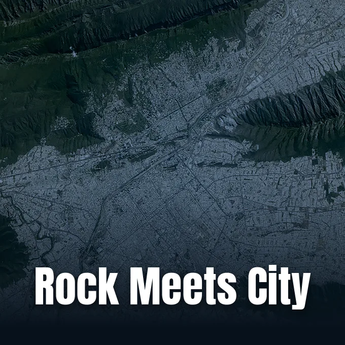 Astronaut photograph of Monterrey’s urban area beside the curved, parallel ridges of the Sierra Madre Oriental.