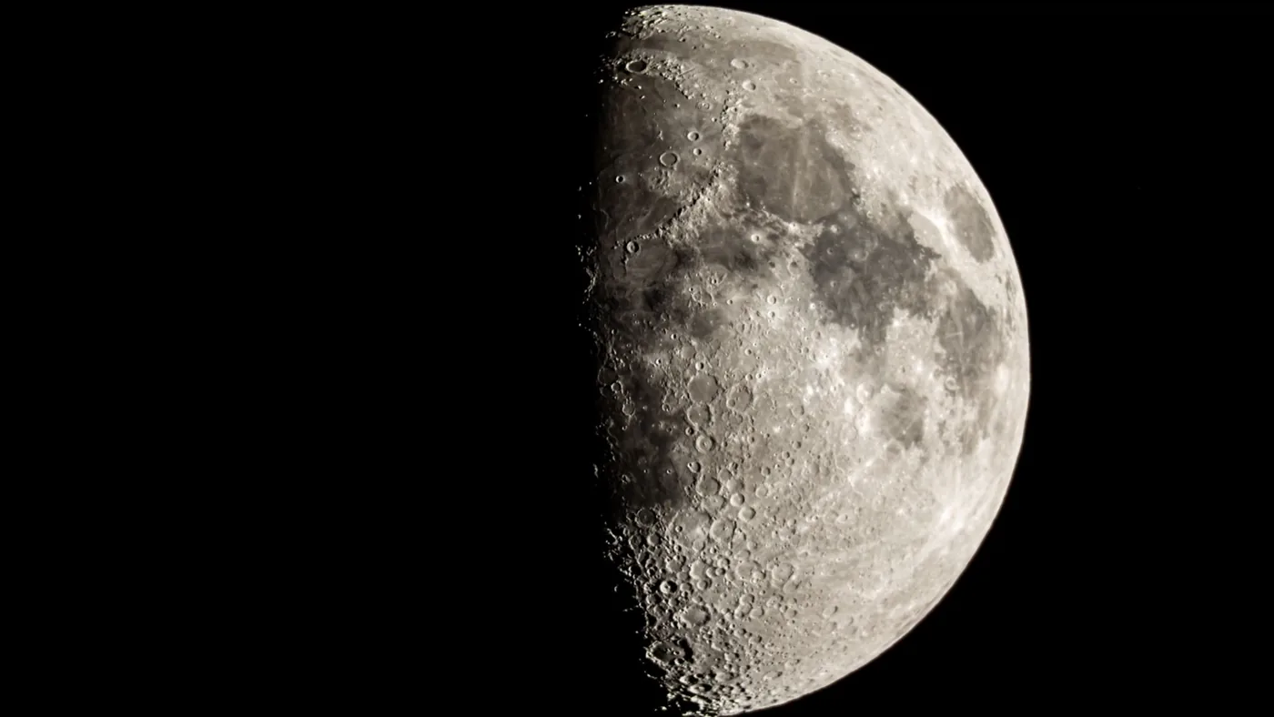 Detailed view of the lunar surface and craters captured for Observe the Moon Night stargazing.