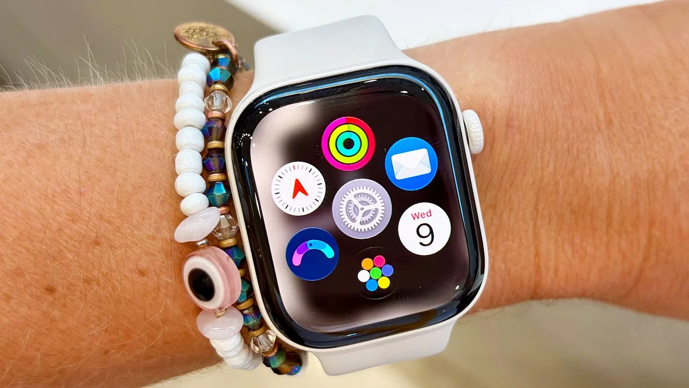 Apple Watch display demonstrating Audio Intelligence features alongside RayNeo iO smart glasses comparisons.