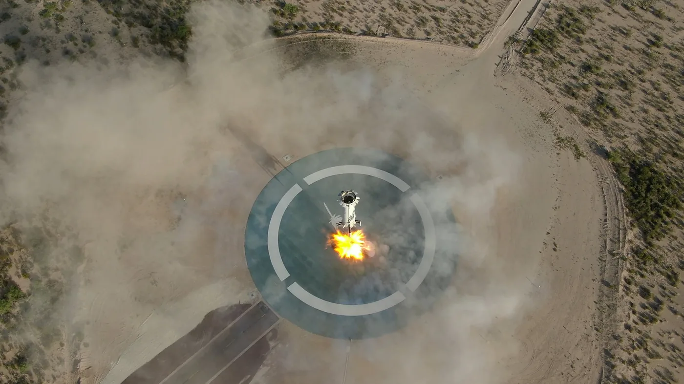 Vertical touchdown of the Blue Origin New Shepard booster testing precision landing systems for safe lunar landings.