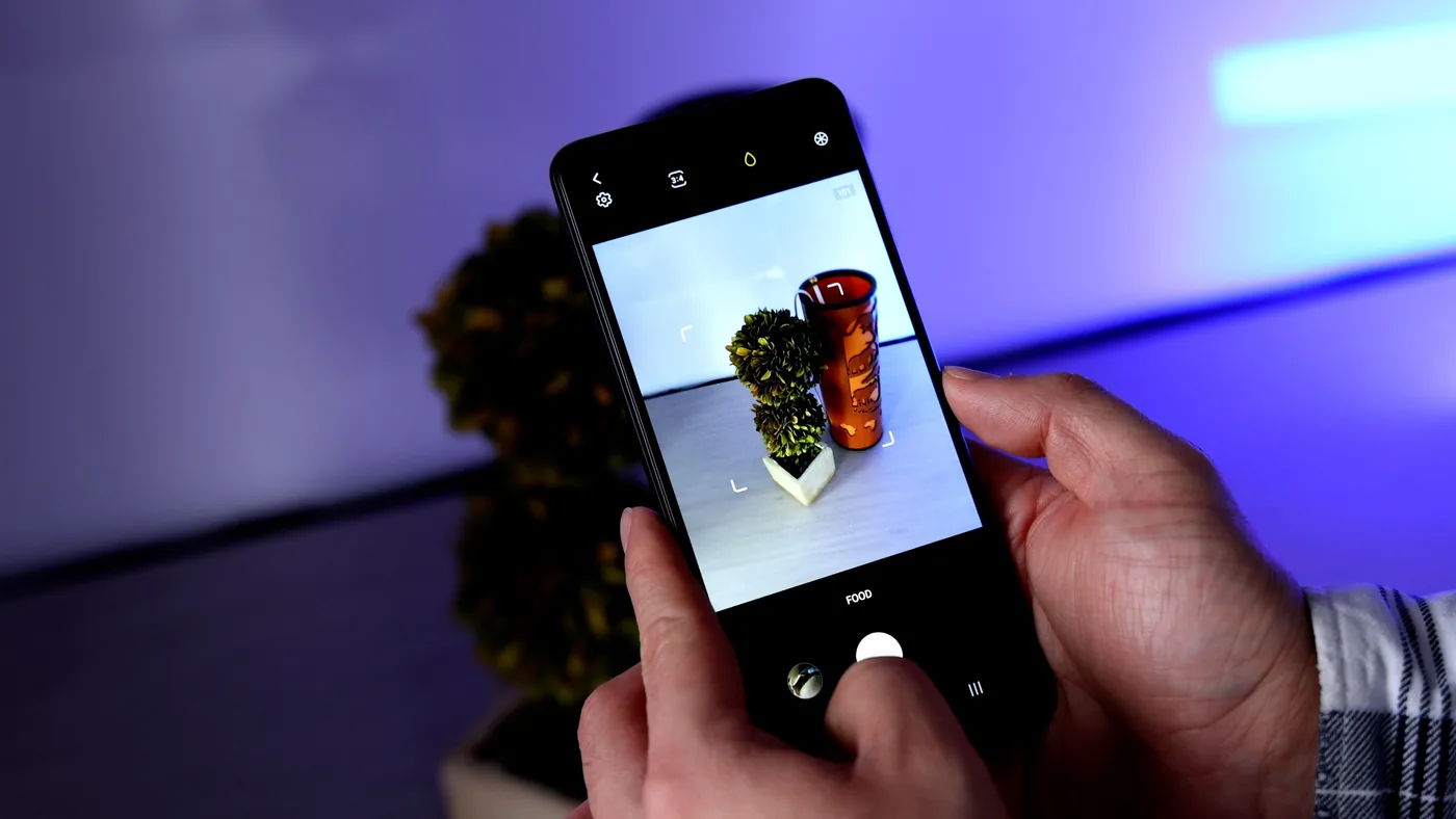 A Samsung Galaxy smartphone displaying Samsung Gallery sync options for Google Photos backup