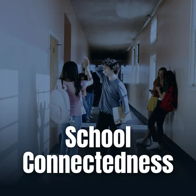 Students walking through a high school hallway between classes.