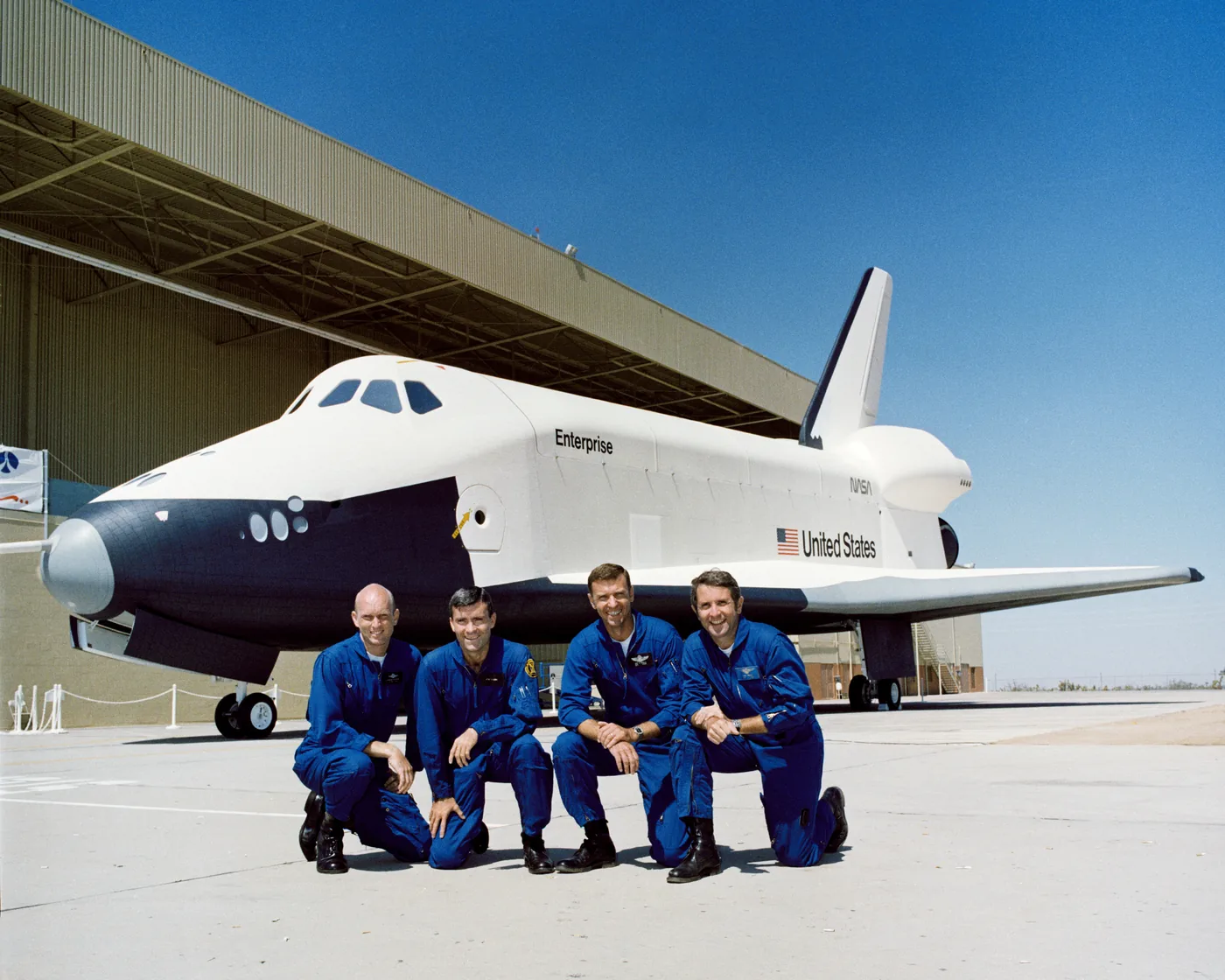 Space shuttle Enterprise parked outside the Palmdale facility with flight crews.