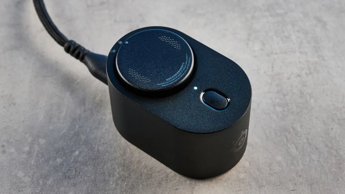 SteelSeries Rival Pro resting beside its dedicated ultra-wideband hub and charging dock