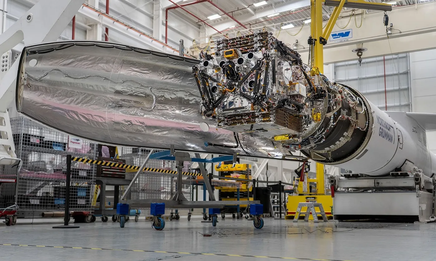LINK servicing spacecraft attached to the front of a Pegasus XL rocket