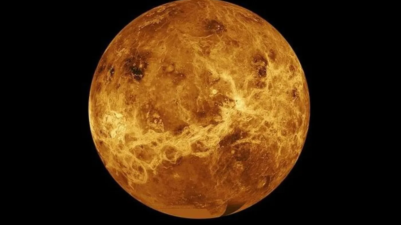 Illustration of a hypothetical Venusian moon in orbit above the planet's thick atmosphere.
