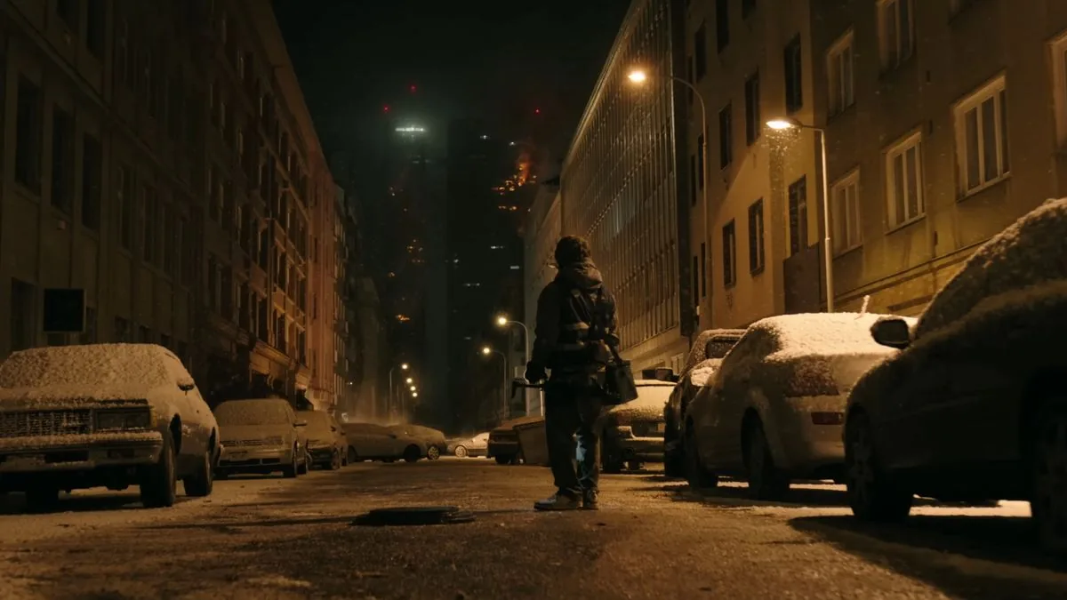 Bryan looks at the burning hospital from the street in the Zach Cregger producer project.
