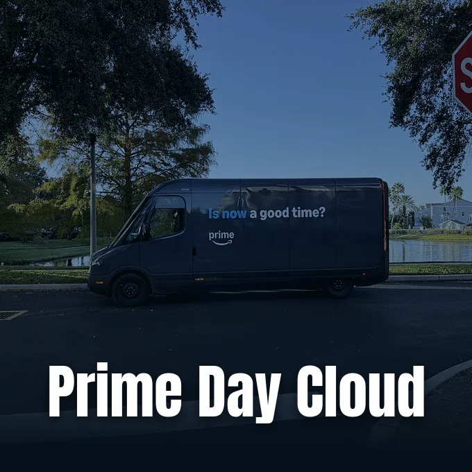 An Amazon Prime electric delivery van parked outdoors next to a suburban road and trees.