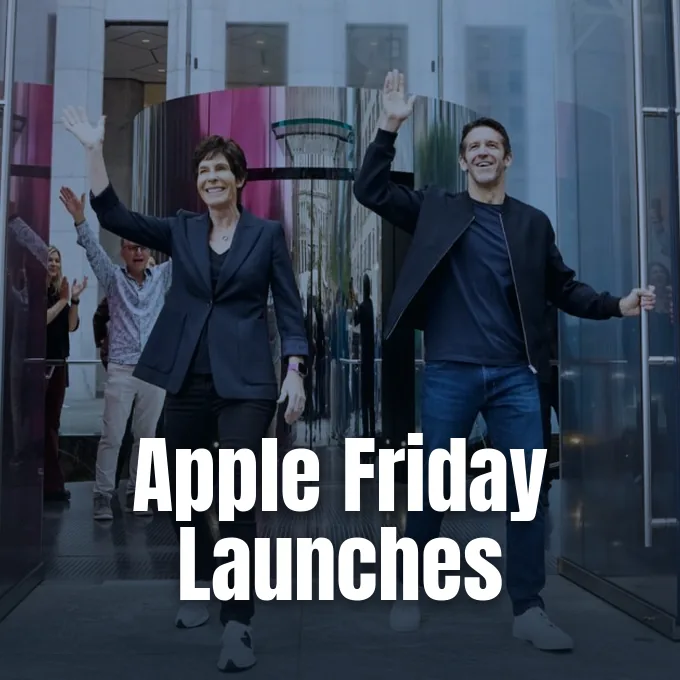 Apple retail executives and employees welcoming customers and waving at a store entrance launch event