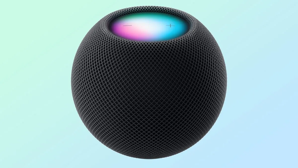 Apple HomePod mini smart speaker shown in midnight color.