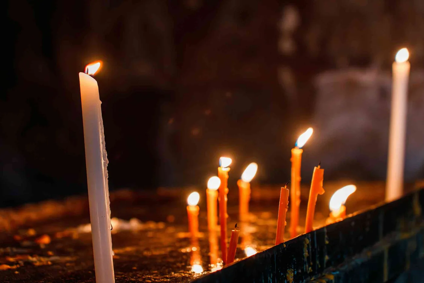 Candles flickering during an Armenian requiem memorial service