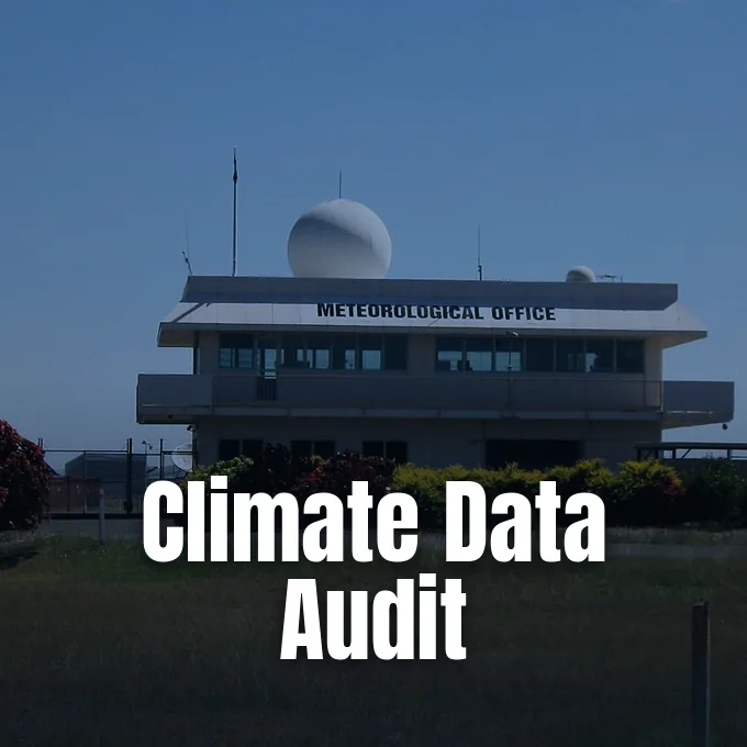 A meteorological office building equipped with weather radar domes under a clear blue sky.