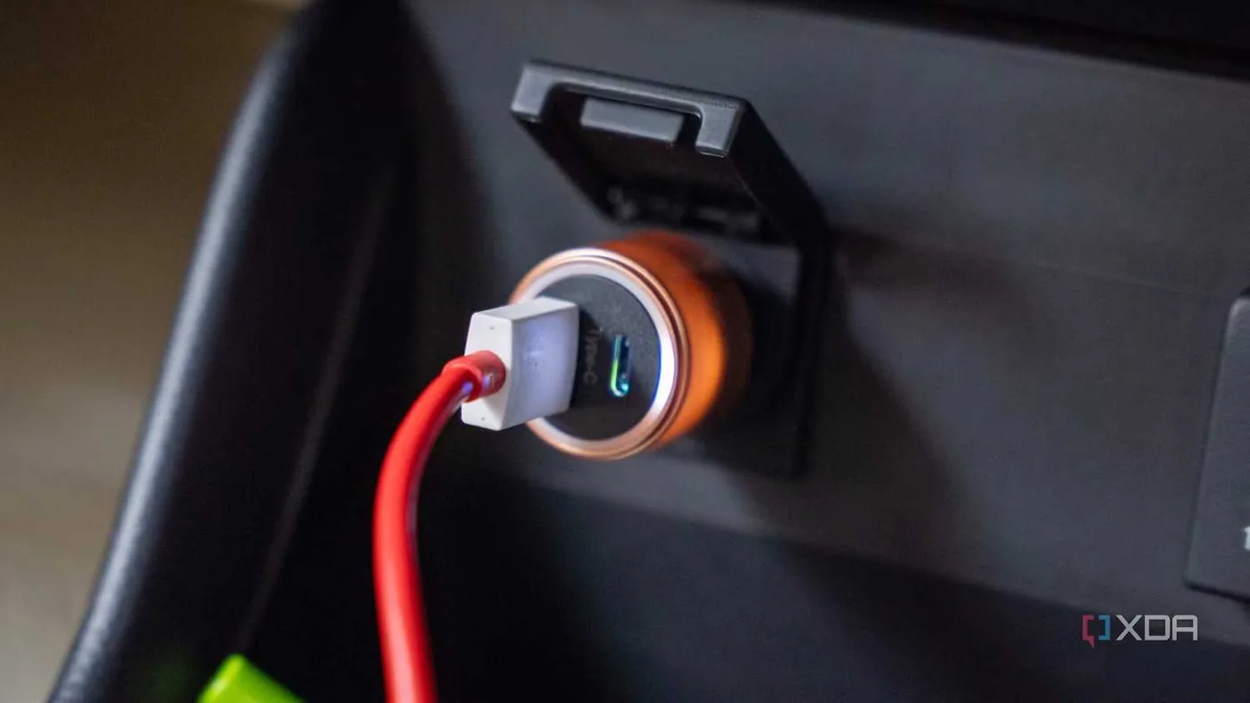 A 12V USB charging adapter installed in a car console