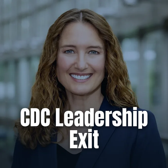 Portrait of Dr. Jennifer Shuford smiling in front of a blurred architectural background.