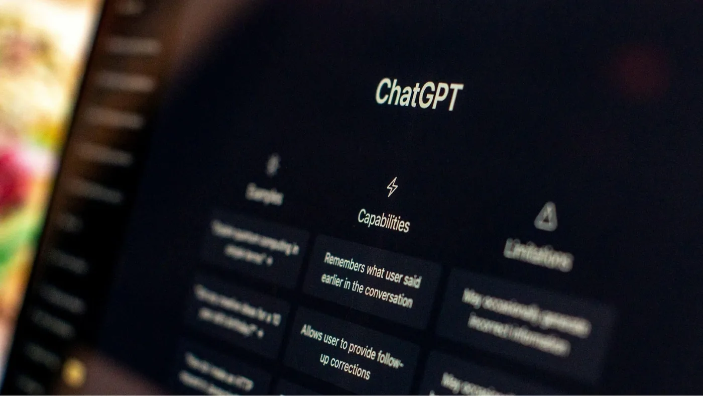 An adolescent user interacting with artificial intelligence software on a digital display.