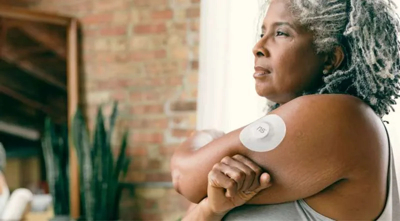 A continuous glucose monitors sensor worn on the arm