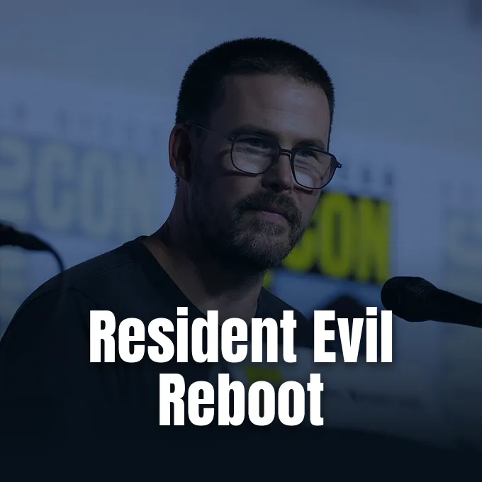 Zach Cregger speaking into a microphone while sitting at a discussion panel at Comic-Con.
