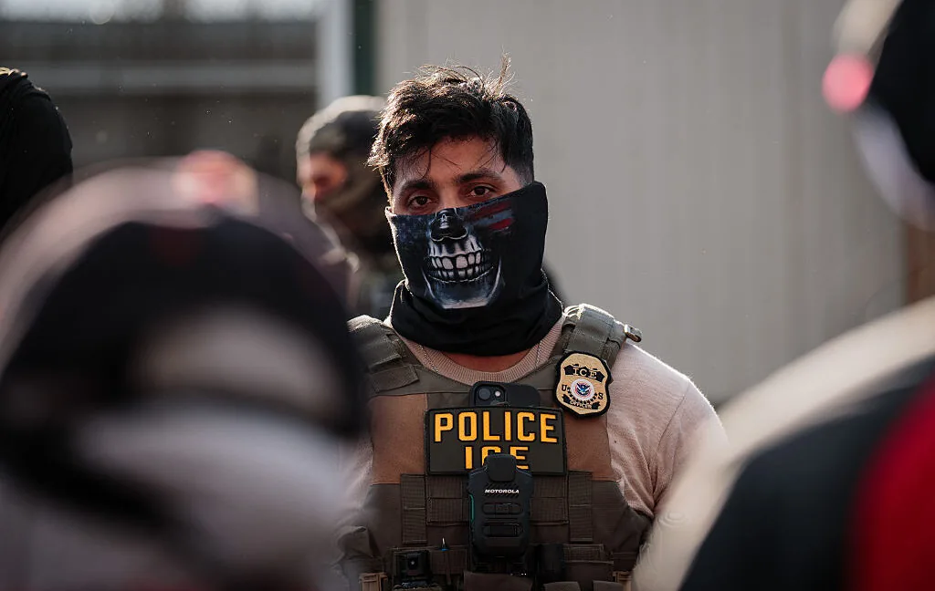 An ICE officer in uniform representing records exposed in the DHS data leak.