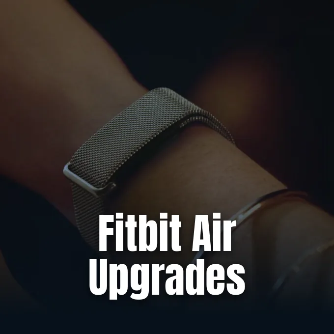 A close-up view of a wrist wearing a stainless steel mesh fitness tracker band.