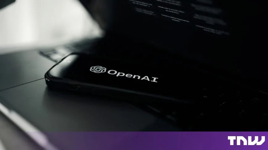 OpenAI logo shown on a smartphone screen next to an open laptop following warnings from a former OpenAI employee