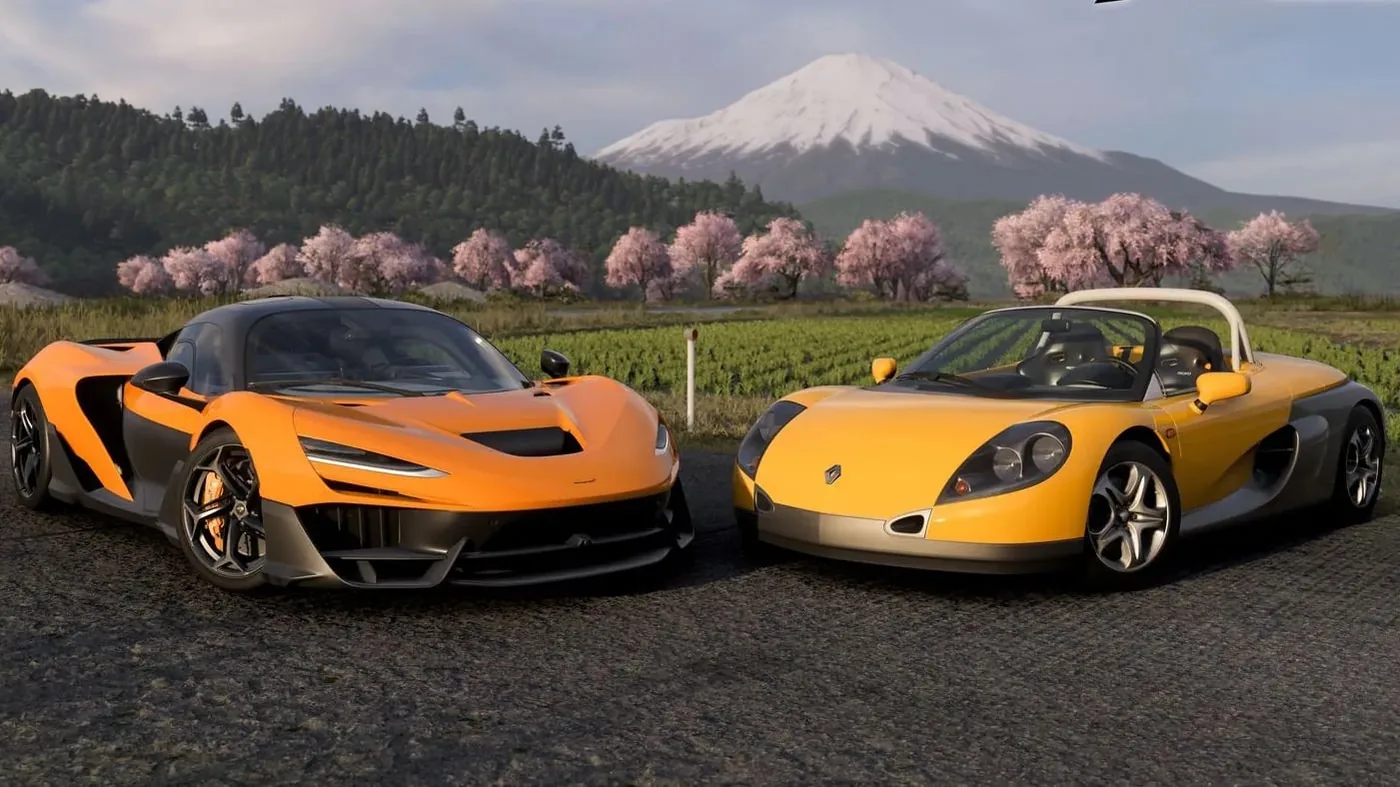 Vehicles driving across an open festival map in the racing sequel.