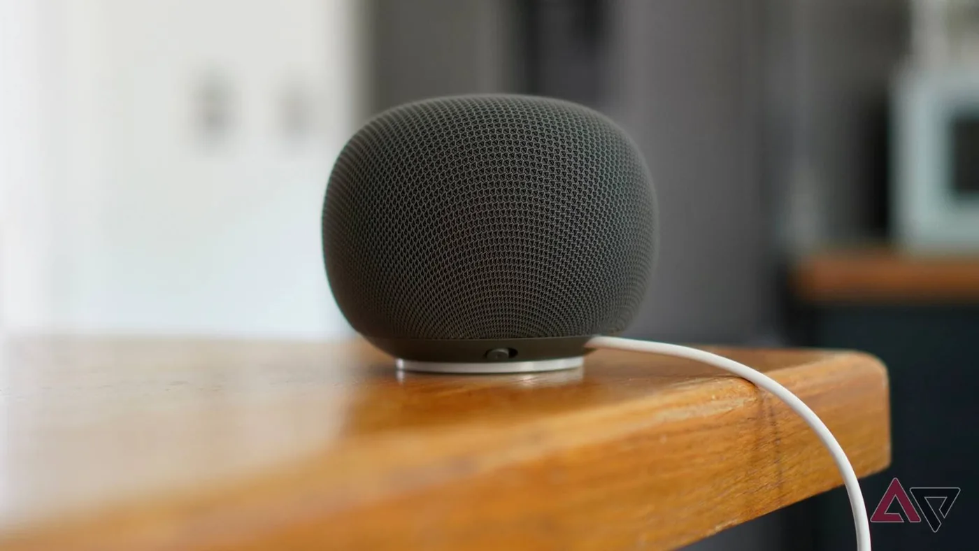 Side profile view of google home speakers on a table.
