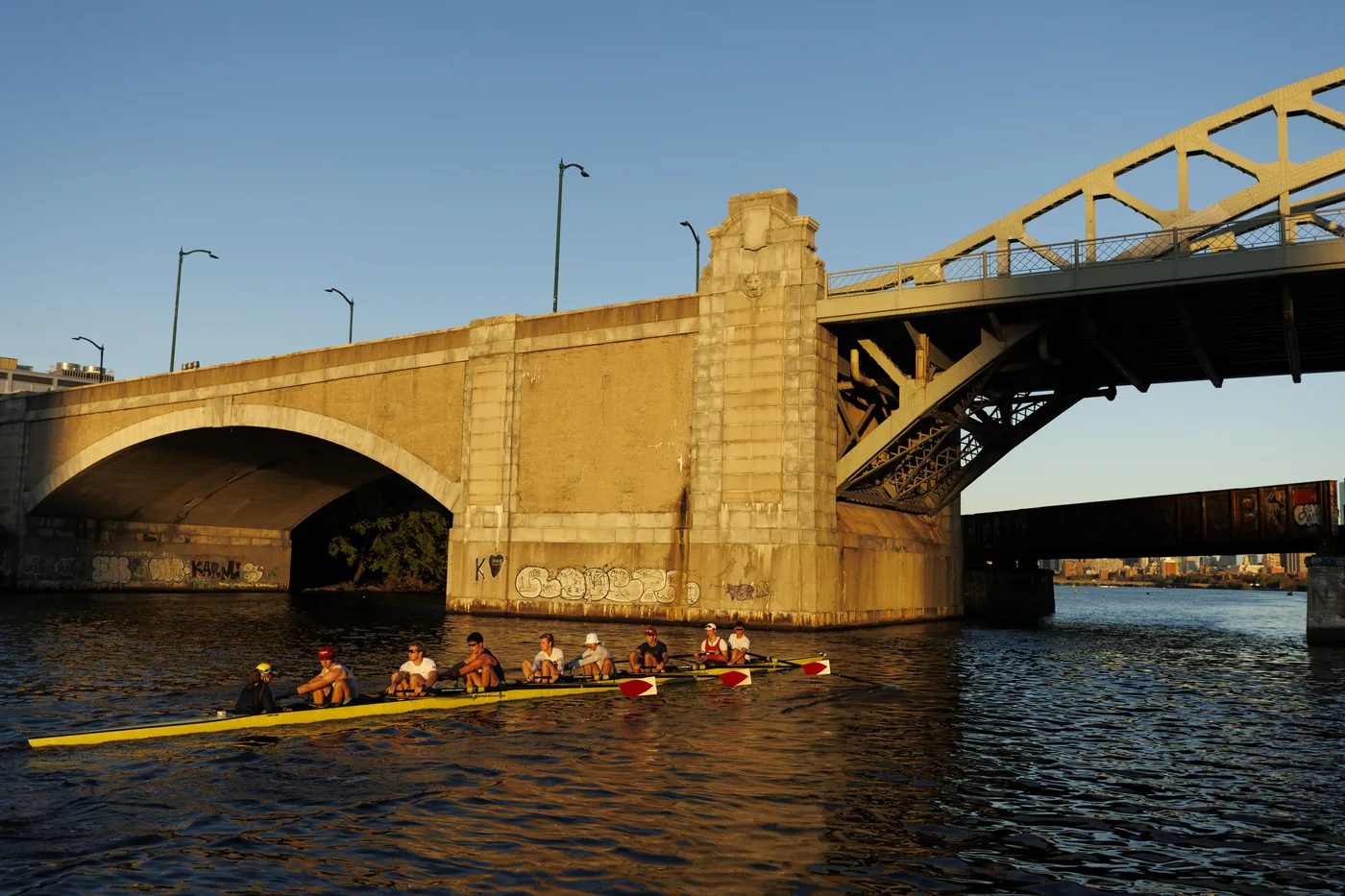 Rowers at the Head of the Charles pass under the Boston University Bridge.