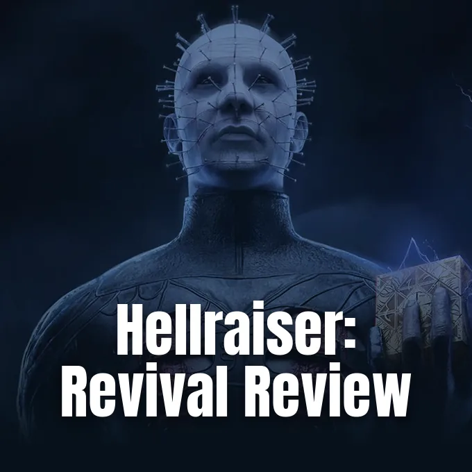 Pinhead standing in darkness while holding the glowing Puzzle Box in his hand.