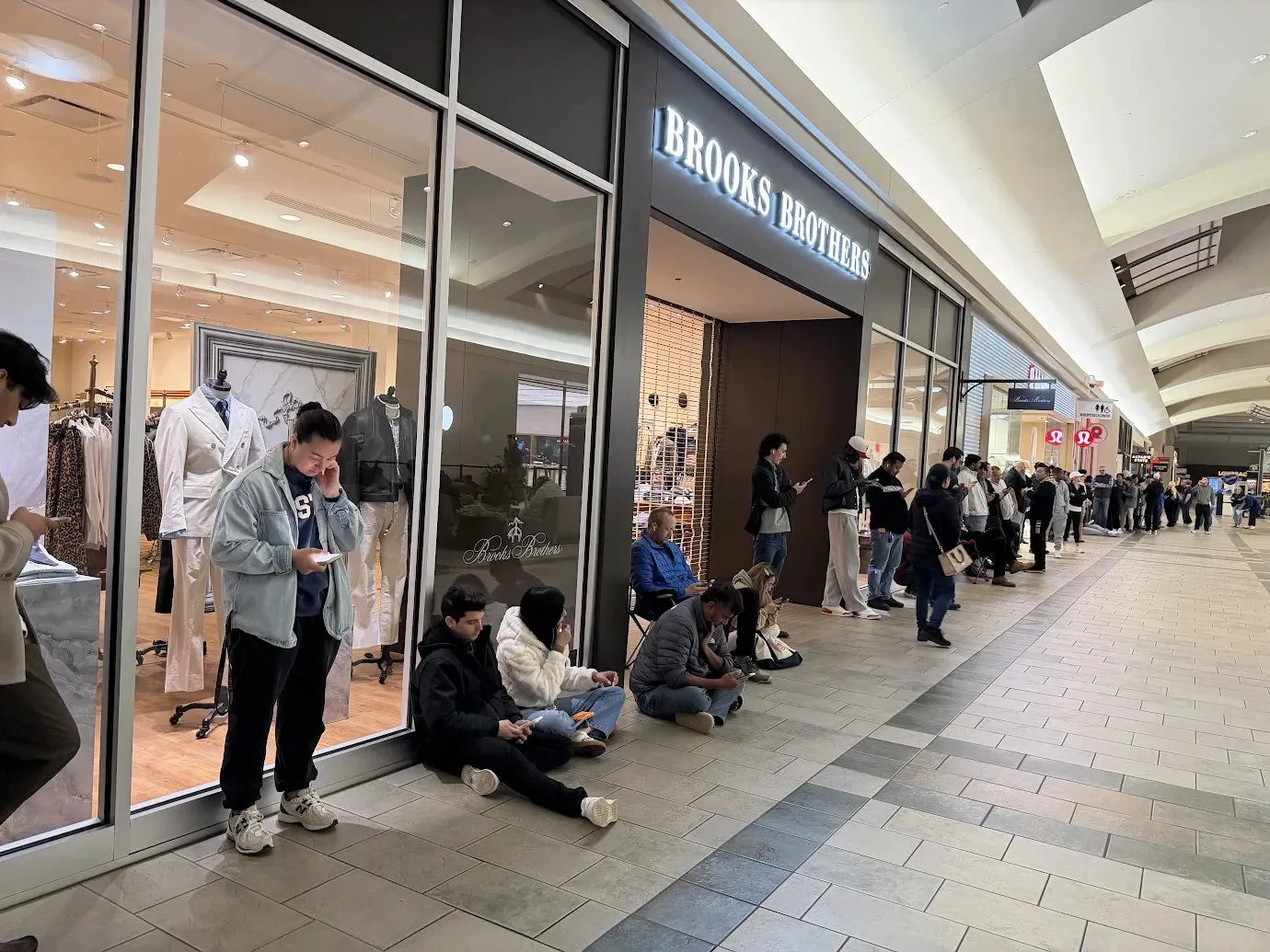 Shoppers waiting inside Oxmoor Center in Louisville before store opening