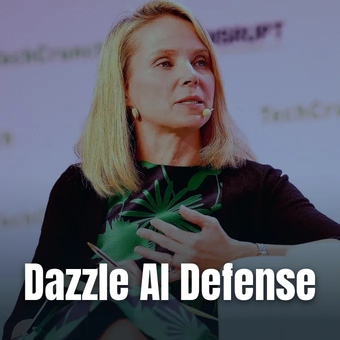 Marissa Mayer speaking on stage during a panel discussion while gesturing with her hands