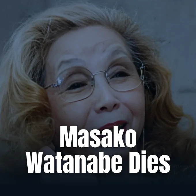 A portrait of Japanese manga artist Masako Watanabe smiling and wearing round eyeglasses.