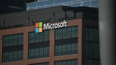 Signage outside company facilities during Microsoft voluntary buyouts announcements.