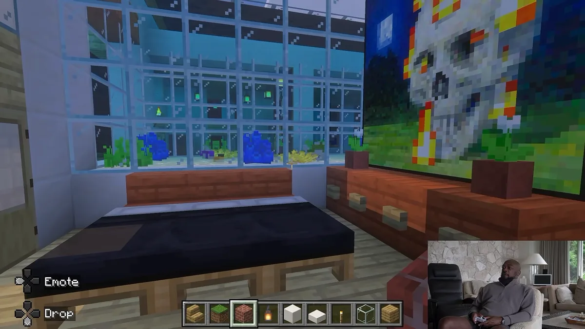 Interior view of an apartment suite featuring an adjacent aquarium in Mike Tomlin's Minecraft metropolis.