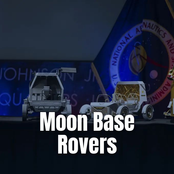 Moon terrain rover prototypes on display during a NASA presentation with an agency flag