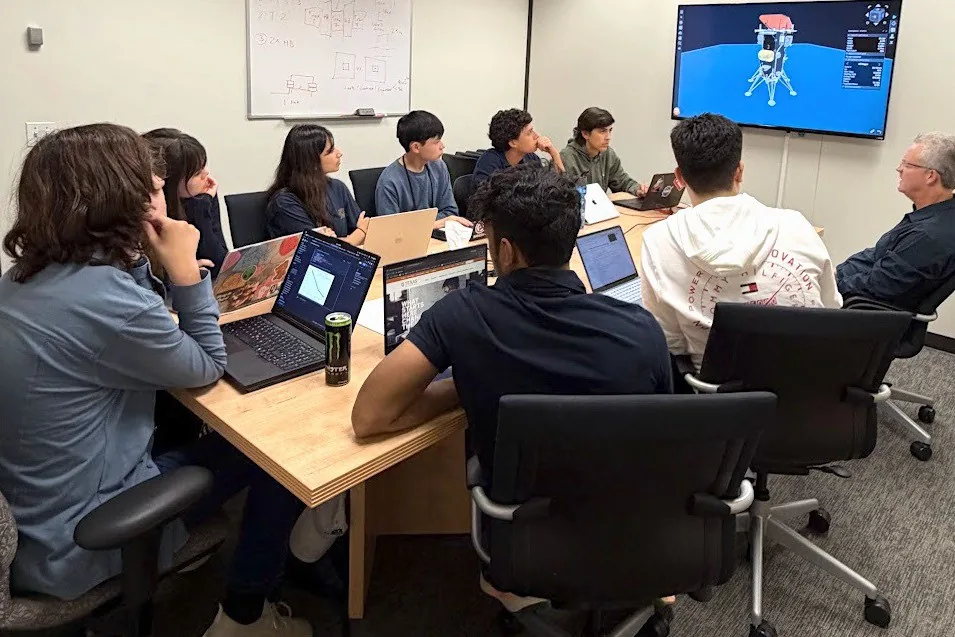 Students in the NASA SEES internship examine mission data during their summer research project.