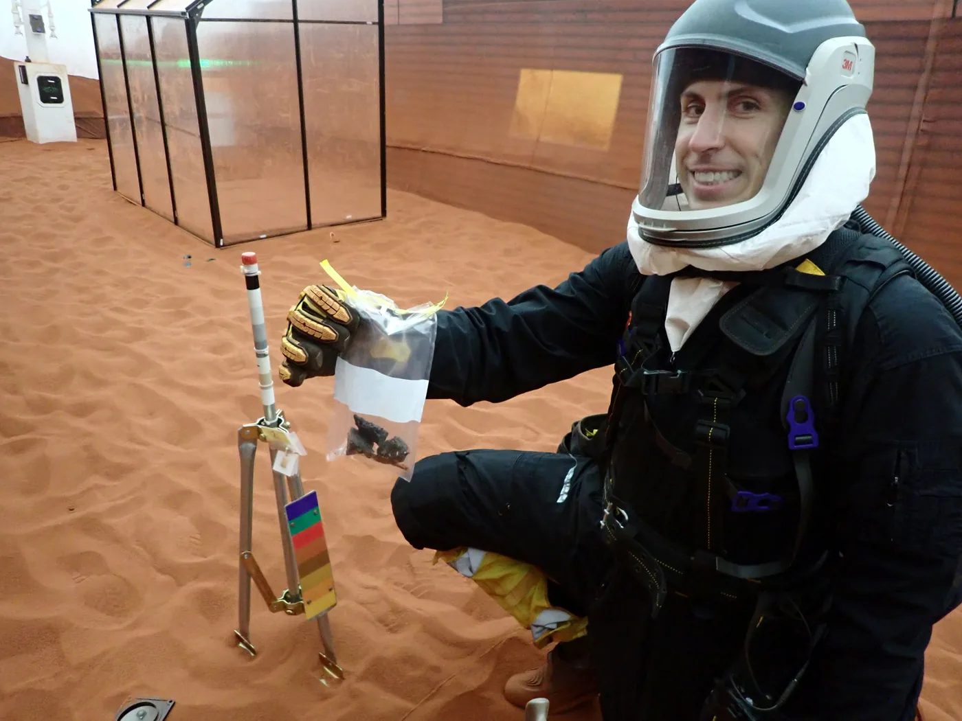Ross Elder displaying geological samples collected during surface exploration