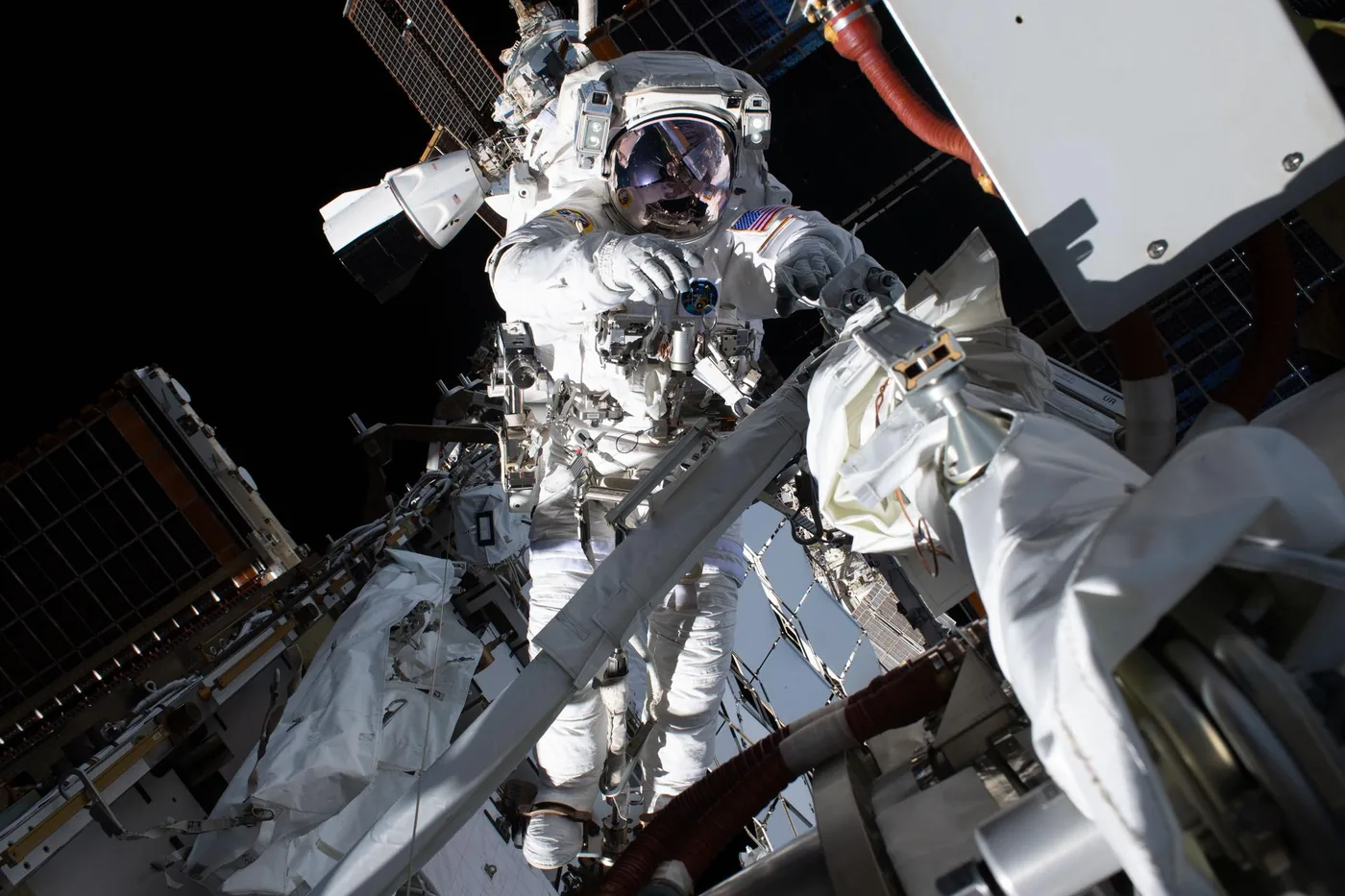 Exterior view of the International Space Station showing truss structures and solar panels in orbit.