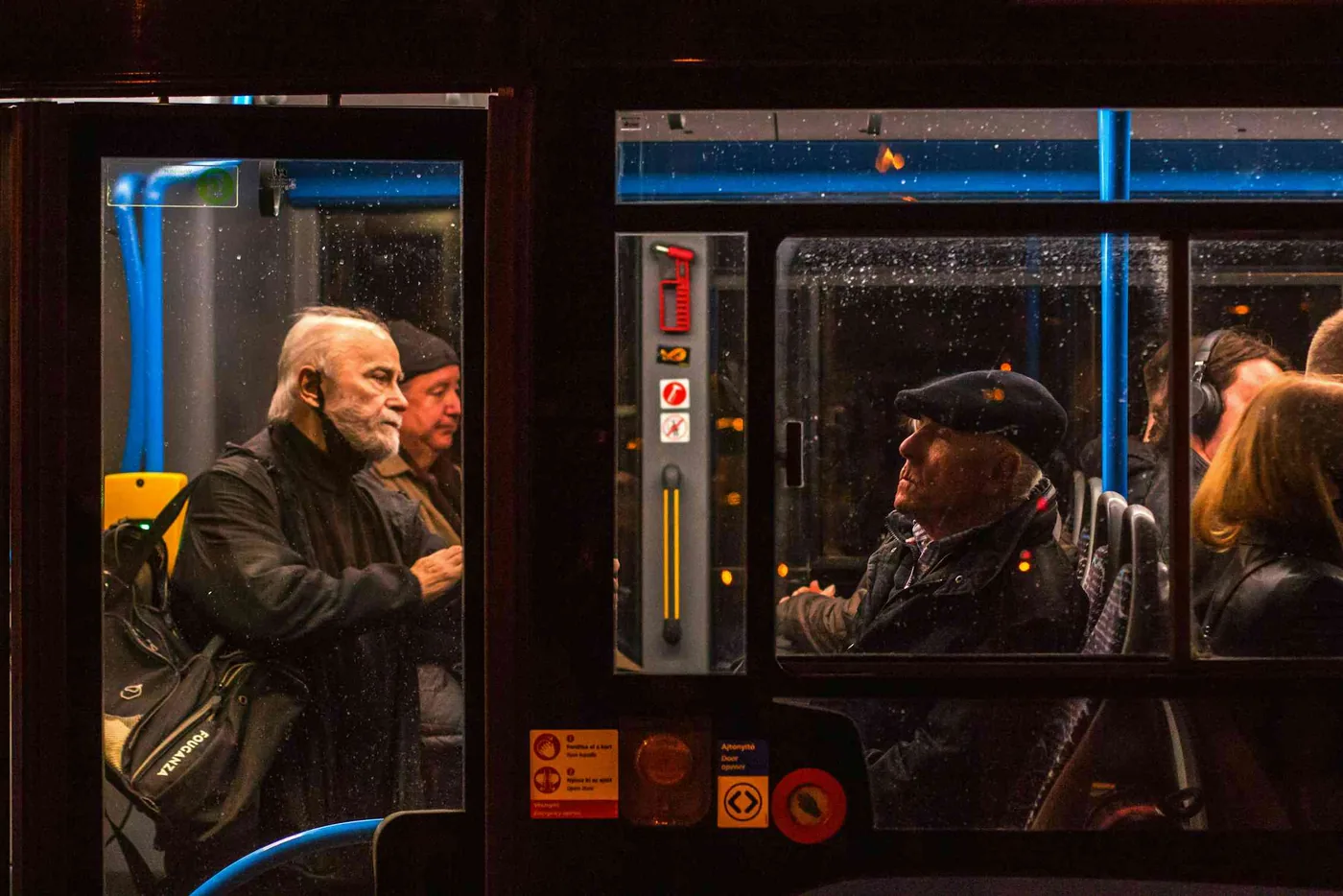 Passengers traveling together on a city transit bus.