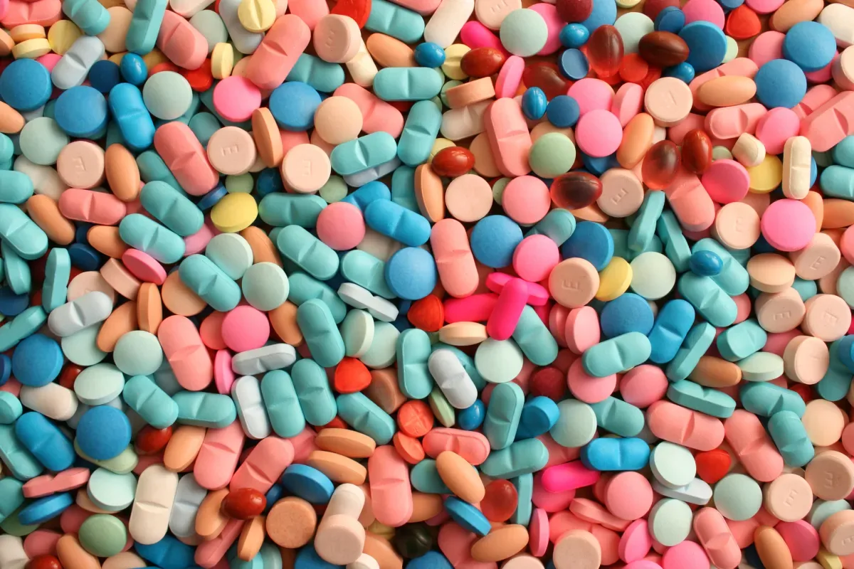 Pills and capsules shown in reporting on the Orchestra Bio acquisition by OpenAI.