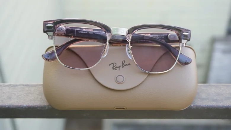The Ray-Ban Meta Audio glasses resting on top of the charging case